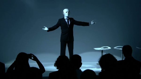 humanoid robot talks on stage costume maschinenmensch